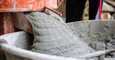 cement pouring into wheelbarrow