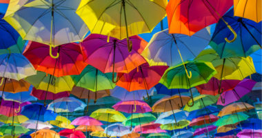 multi-colored umbrellas hanging in the air