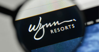 Magnifying glass over Wynn Resorts logo
